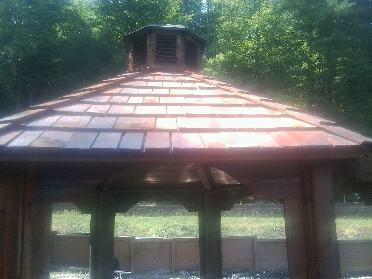New cedar shake roof and cupola on a lakeside gazebo in Brooklyn